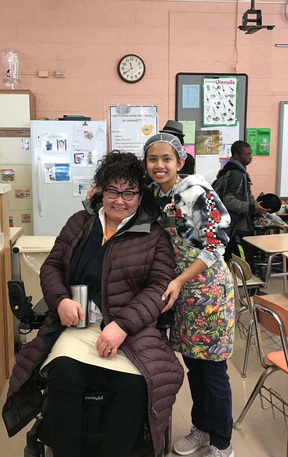 DRS Director Patrick posing with a student during her campus tour.
